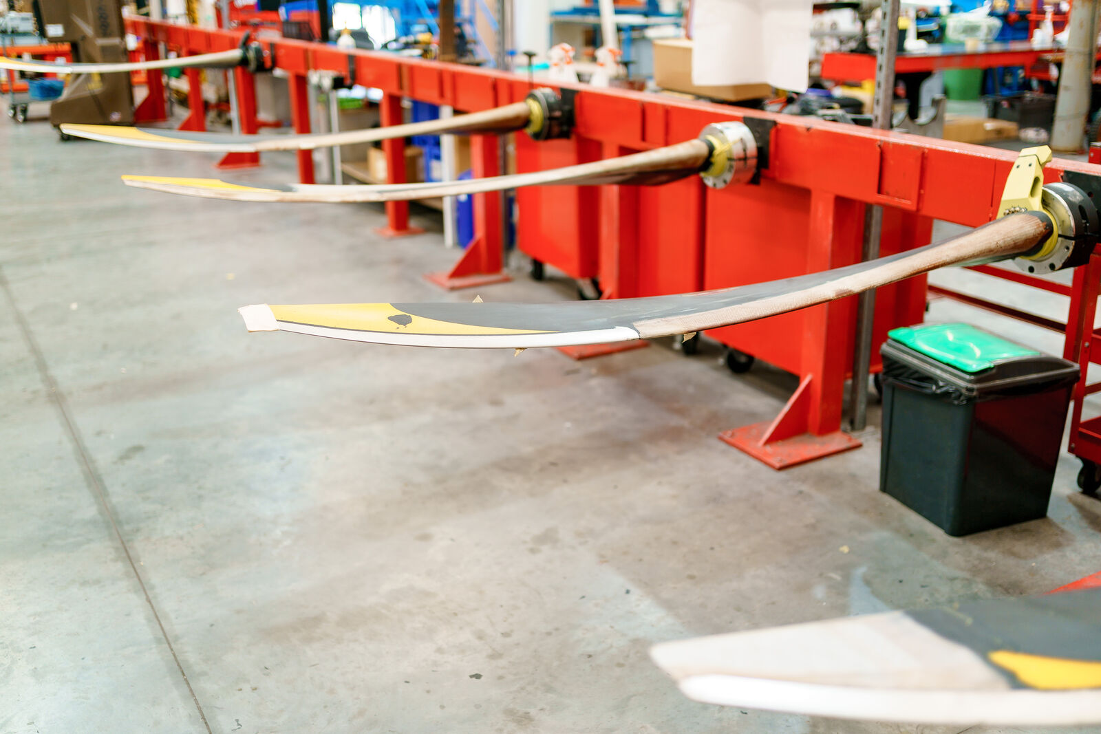 Propeller blades held on workshop stands ready for assembly