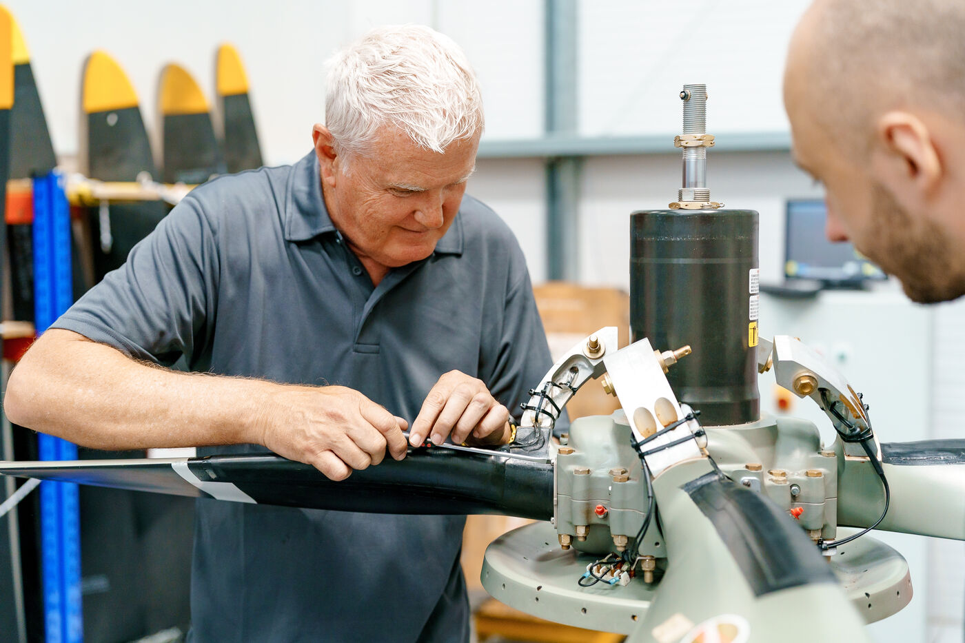 ROKK engineers working on a propeller hub assembly